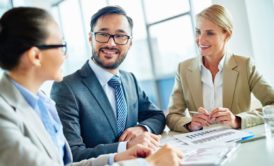 three colleagues communicating effectively in the workplace