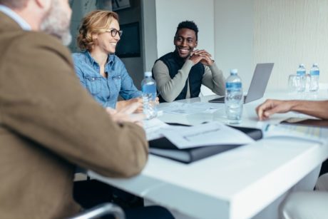 three managers talking in a meeting