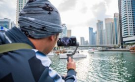 man recording a documentary with smartphone