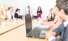 manager talking to team in conference room