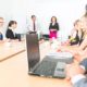 manager talking to team in conference room