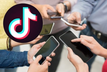 tiktok logo and group of people holding smartphones