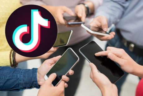 tiktok logo and group of people holding smartphones