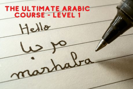 person writing arabic greeting marhaba on paper