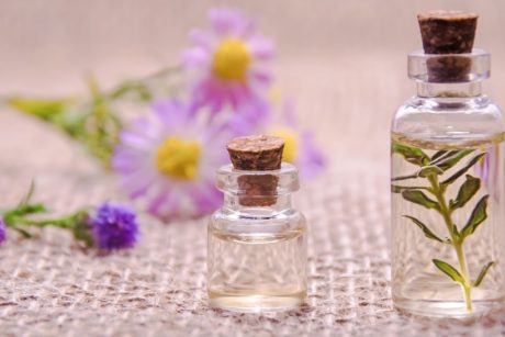 lavender flowers and aromatherapy oil in vials