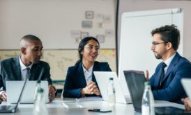 three colleagues having a workplace meeting