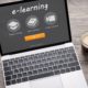 silver laptop with word e-learning on display