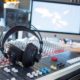 headphones on top of mixer in music production studio