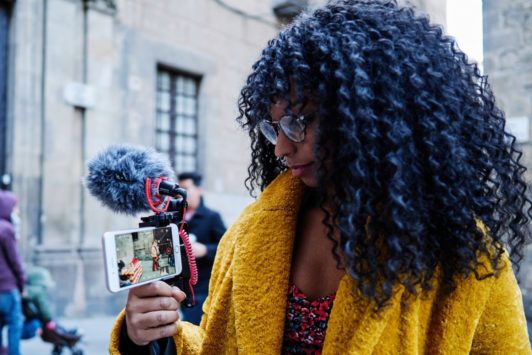 woman filming with her smartphone