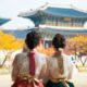 two women wearing traditional korean dress looking