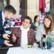 waiter in blue suit dealing with two angry customers