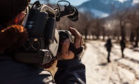 videographer recording a documentary