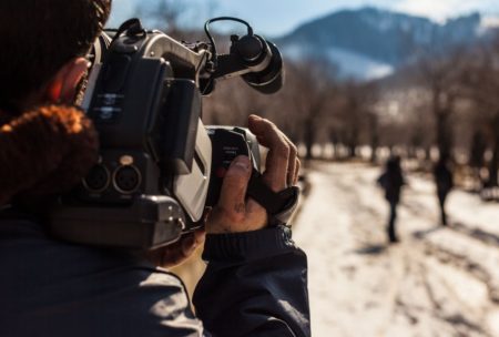 videographer recording a documentary