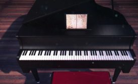 birds eye view of a black grand piano