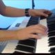 music producer playing a double layered electronic organ