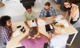 team of six people having a meeting