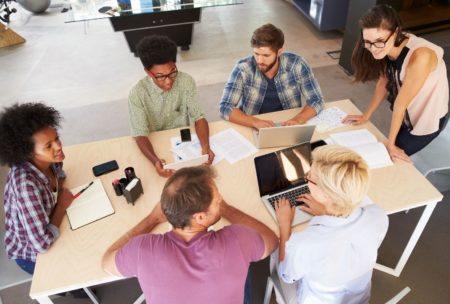 team of six people having a meeting