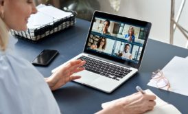 woman in a meeting with virtual team