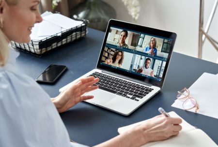 woman in a meeting with virtual team