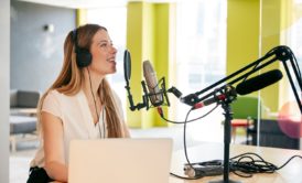woman recording a podcast in studio
