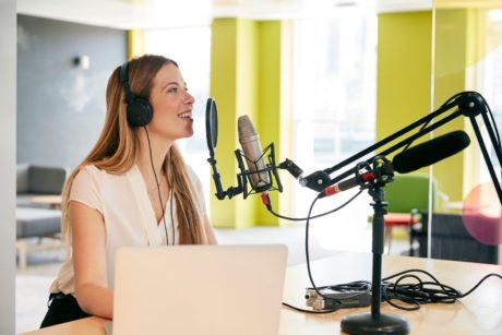 woman recording a podcast in studio