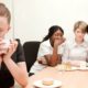 woman being bullied in the workplace by her female colleagues