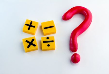 mathematical symbols beside a big red question mark