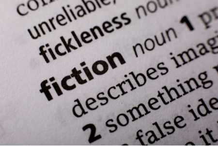 close up of the word fiction in the dictionary