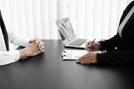 male applicant being interviewed by recruiter