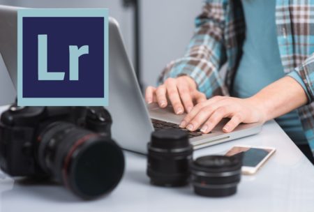 lightroom logo and person typing on silver laptop