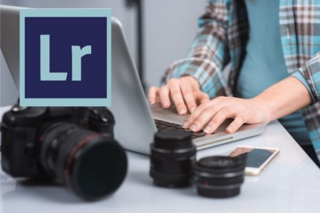 lightroom logo and person typing on silver laptop