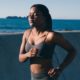 female runner in a green sports bra