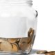 clear glass jar filled with bronze coins