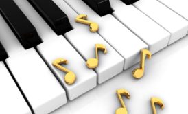 close up of piano keys and random music notes