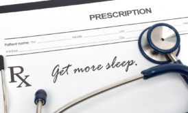 stethoscope and prescription with writing get more sleep