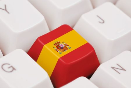 spanish flag displayed on a keyboard, representing a comprehensive full spanish course