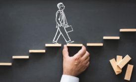 chalk drawing of a man walking on wooden chips