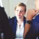 female applicant talking to two interviewers