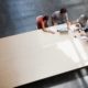 team meeting with four members at edge of large table