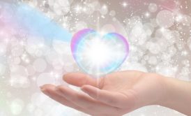hand holding a white glowing orb