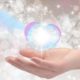 hand holding a white glowing orb