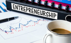 black bound book with label entrepreneurship on the side