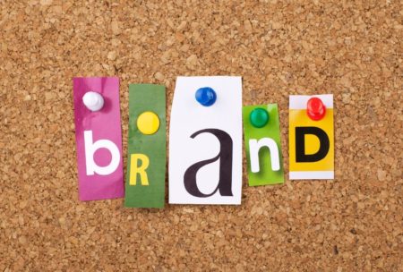 cut outs spelling the word brand