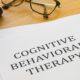 cognitive behavioral therapy printed on paper in all capital typeface