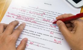 man proofreading and editing an article