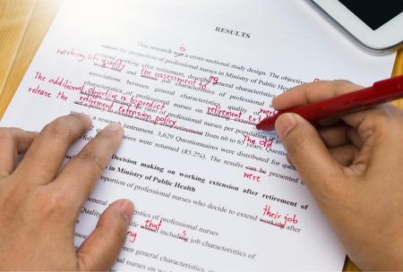 man proofreading and editing an article