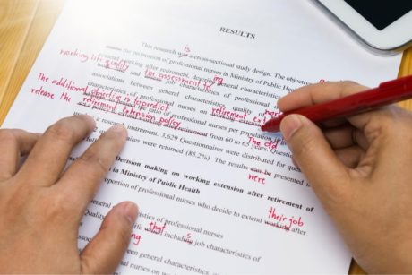 man proofreading and editing an article
