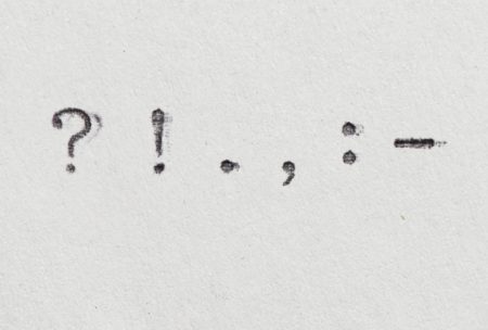 punctuation marks typewritten on white paper