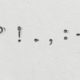 punctuation marks typewritten on white paper