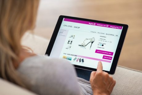 woman managing online dropshipping store on her ipad device